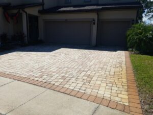 a paver driveway with red rust